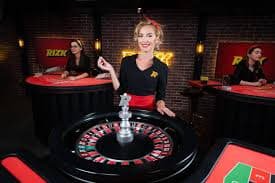 Tabel pembayaran Dragon Fishing hongkong lotto menampilkan nilai setiap simbol, volatilitas, dan statistik RTP